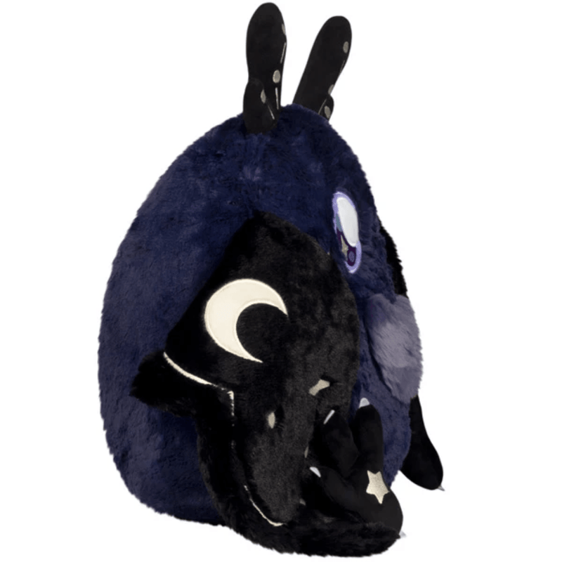 Side view of Squishable Midnight Mothman showing its midnight-blue body and crescent moon wing