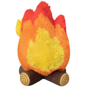 Back view of campfire plush toy showing layered flame colours and plush log base


