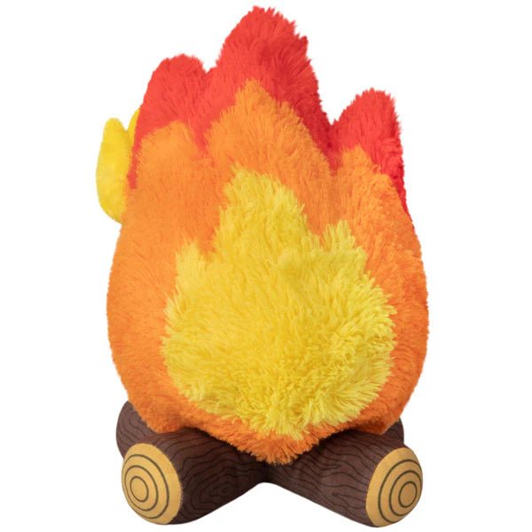 Back view of campfire plush toy showing layered flame colours and plush log base


