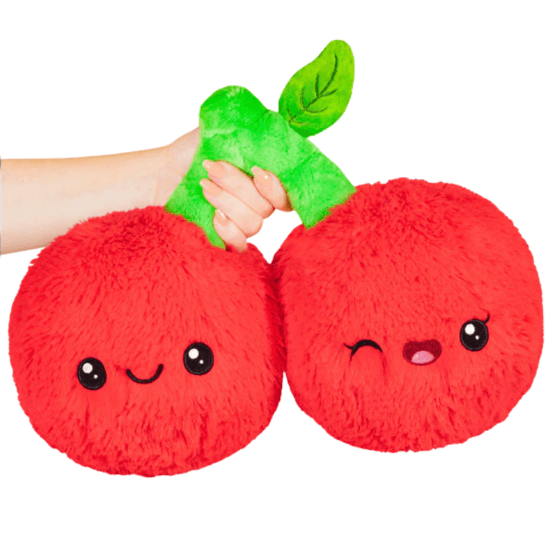 Mini Squishable Comfort Food Cherries plush toy held in hand against a plain light background