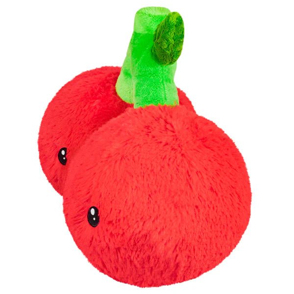 Side view of Squishable cherries plushie showing round red fruit and stitched eyes

