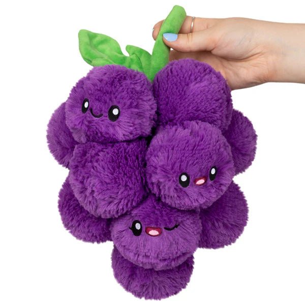 Front view of Squishable Mini Grapes plushie with smiling faces and green stem

