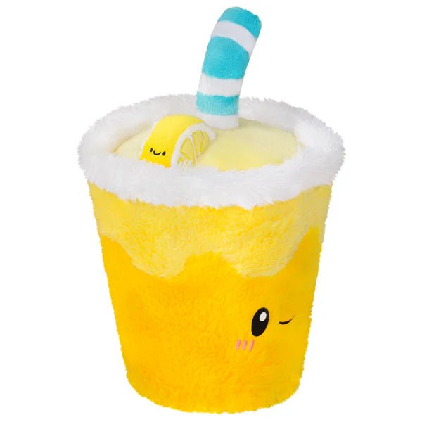 Side view of the Mini Comfort Food Lemonade plushie with a plush lemon wedge and cheeky winking face.