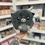 Mini Squishable Gargoyle plush toy held in hand in a gift shop, front view
