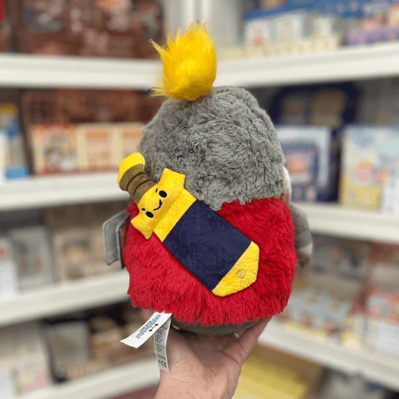Mini Squishable Knight plush toy held in hand in a gift shop, back view with sword detail