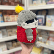 Mini Squishable Knight plush toy held in hand in a gift shop, side view