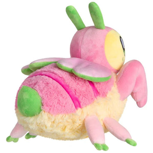 Side view of plush orchid mantis with folded legs and yellow fuzzy belly

