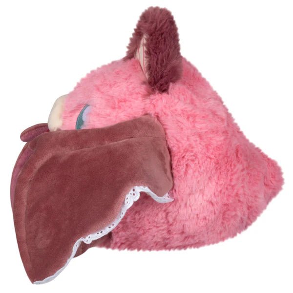 Side profile of the Mini Sweetheart Bat plush highlighting dusky-rose wing and fluffy pink fur