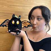 Squishable Alter Egos Monarch Mothman plush being held