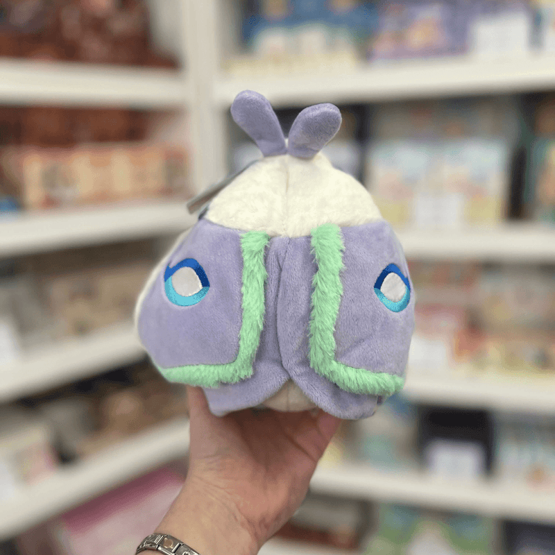 Squishable Party Snacker Lilac Luna Moth plush toy held in hand, back view