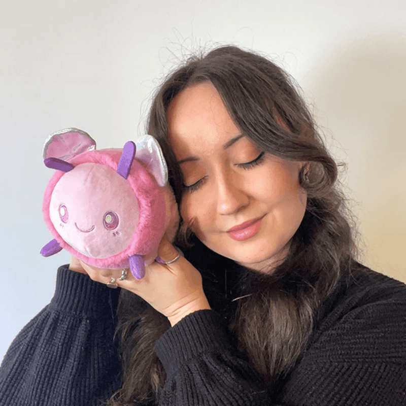 Squishable Party Snacker Pink Bee plush toy being held for size comparison