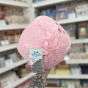 Back view of Squishable Piggy plush toy showing its soft pink fluffy body, little curly tail and official Squishable label