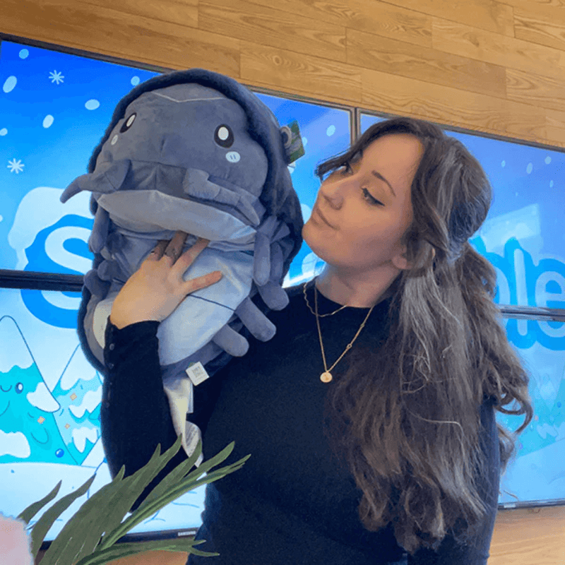 Squishable Pillbug Rollie Pollie plush being held to show its large size