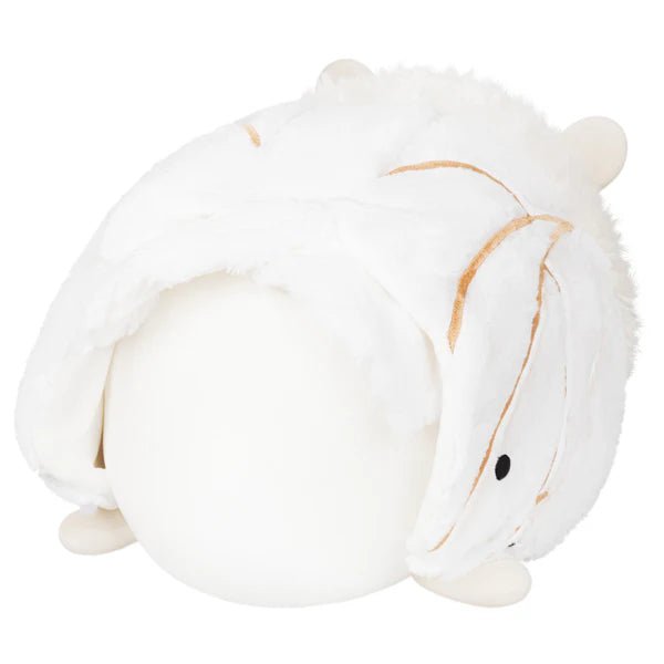 Back view showing white wings with gold detailing on the Squishable Poodle Moth plush.