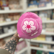 Close-up of Mini Squishable Sakura Plague Doctor plush toy showing the pink floral hat and cherry blossom detail