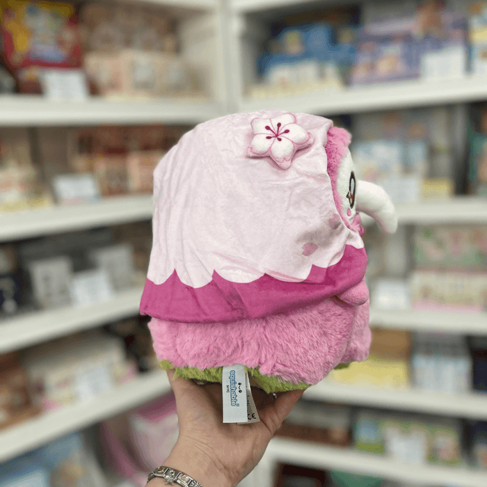 Back view of Mini Squishable Sakura Plague Nurse plush toy with soft pink fur, floral hood and Squishable label