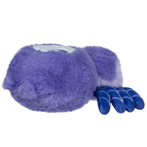 Side view of the Skull Spider plush showing its purple body and web-patterned legs