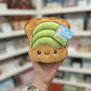 Squishable Snacker Avocado Toast plush toy held in hand, front view