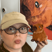 Squishable Snacker Capybara plush being held