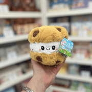 Squishable Snacker Cookie Ice Cream Sandwich plush toy held in hand, front view