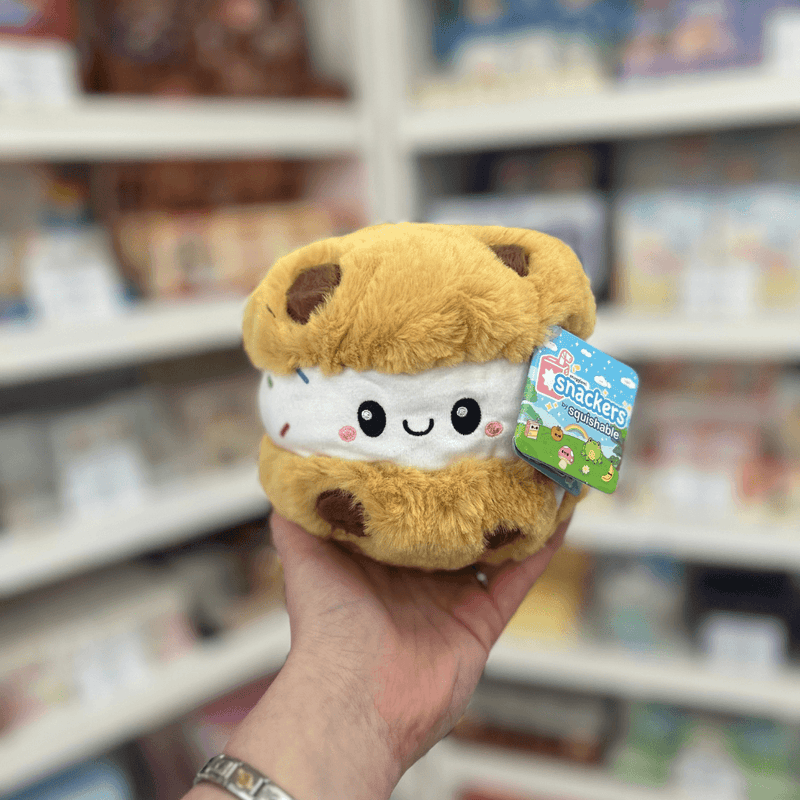 Squishable Snacker Cookie Ice Cream Sandwich plush toy held in hand, front view