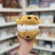 Squishable Snacker Cookie Ice Cream Sandwich plush toy held in hand, side view
