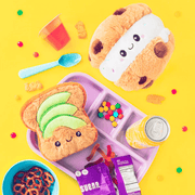 Squishable Snacker Cookie Ice Cream Sandwich plush on yellow background with snack props
