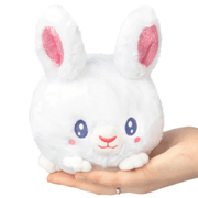 Front view of the Squishable Snacker Fluffy Bunny plush toy with white fur and pink ears