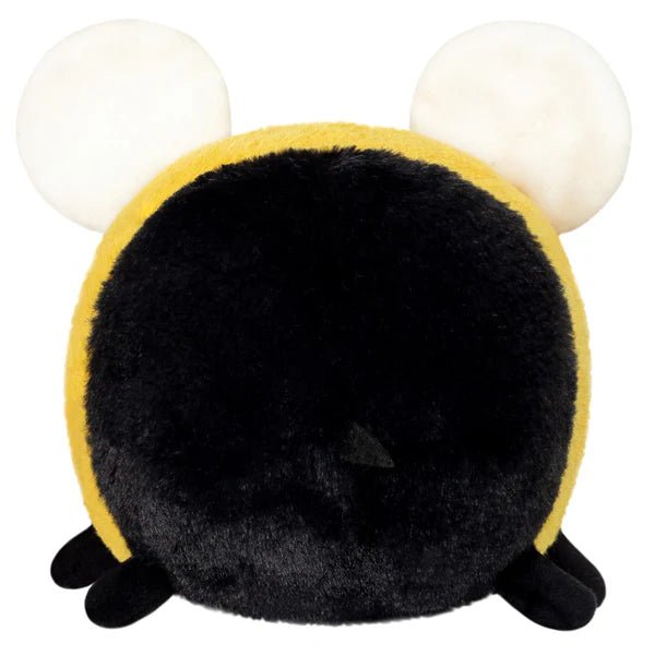 Back view of the Squishable Snacker Fuzzy Bumblebee plushie showing fuzzy black fur and white wings.
