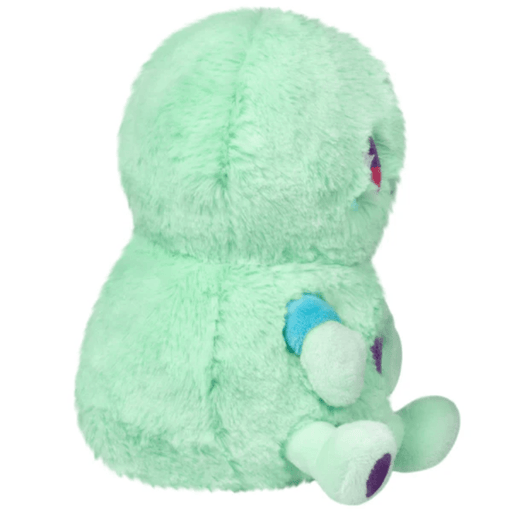 Side view of the Squishable Snacker Green Alien soft toy showing mint-green plush and small arms