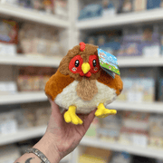 Squishable Snacker Hen plush toy front view held in hand in a shop