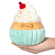Front view of the Squishable Snacker Madame Cupcake plush toy with fluffy icing and cherry topper