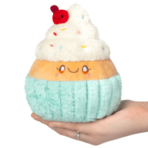 Front view of the Squishable Snacker Madame Cupcake plush toy with fluffy icing and cherry topper