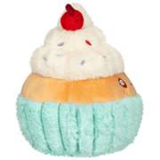Side view of the Squishable Snacker Madame Cupcake soft toy showing pastel cupcake base and fluffy icing