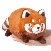 Front view of the Squishable Snacker Red Panda plush toy with orange fur and embroidered face