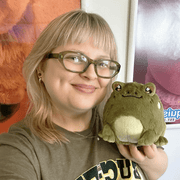 Squishable Snacker Toad S1E6 plush being held to show its compact size