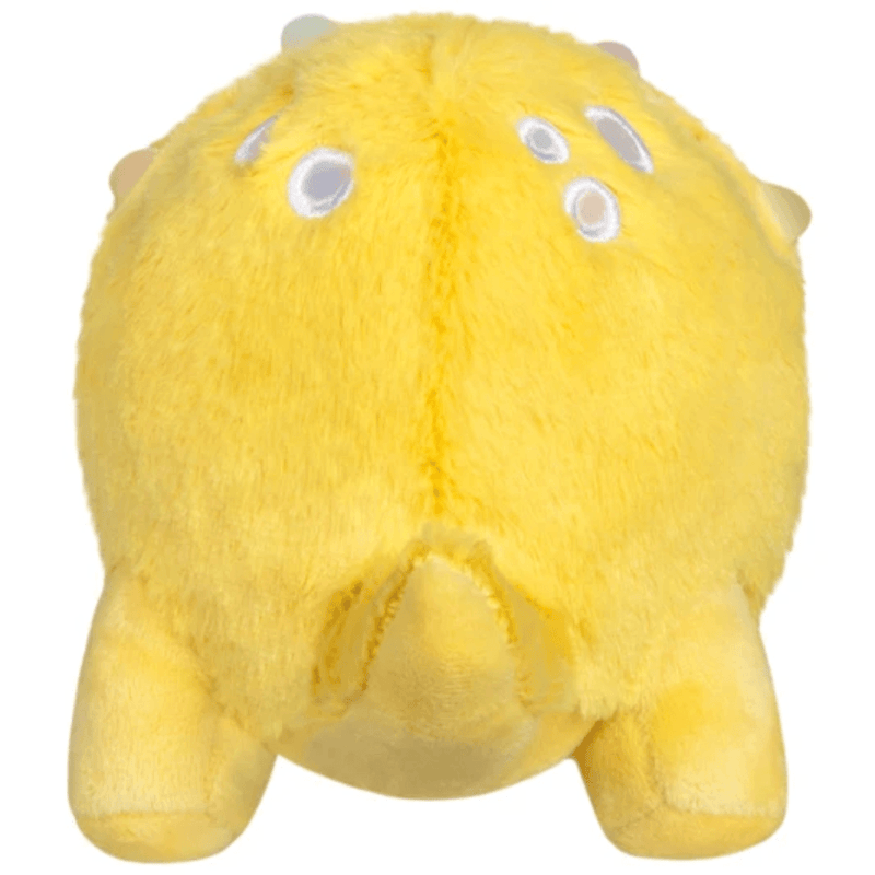 Back of Squishable Snacker Yellow Triceratops plush with pale embroidered markings