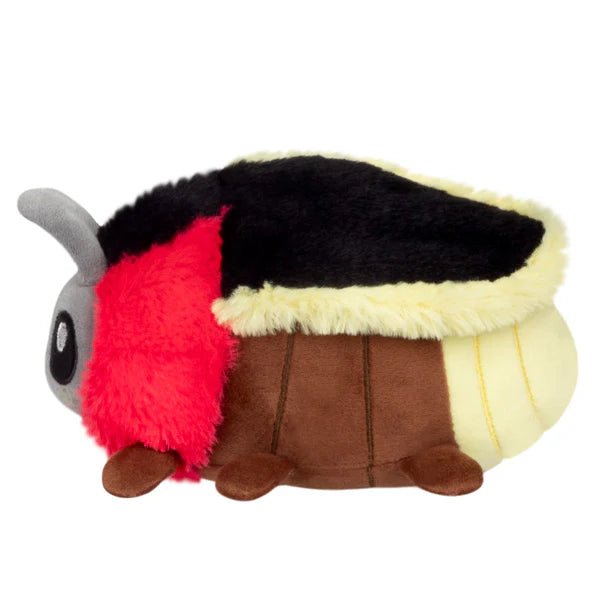 Side profile of the Snackers Firefly plush with red ruff, brown body and grey antennae.