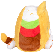 Side view of Squishable Taco Cat plush toy showing layered taco filling and rounded shape.