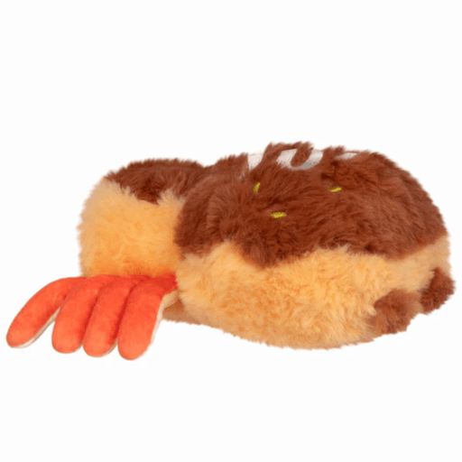 Side view of the Takoyaki Spider plush showing its warm brown body and orange legs