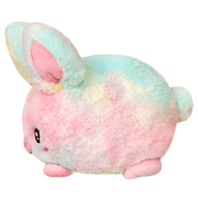 Side view of Squishable Snacker Fluffy Bunny Tie Dye plush toy showing fluffy pastel fur