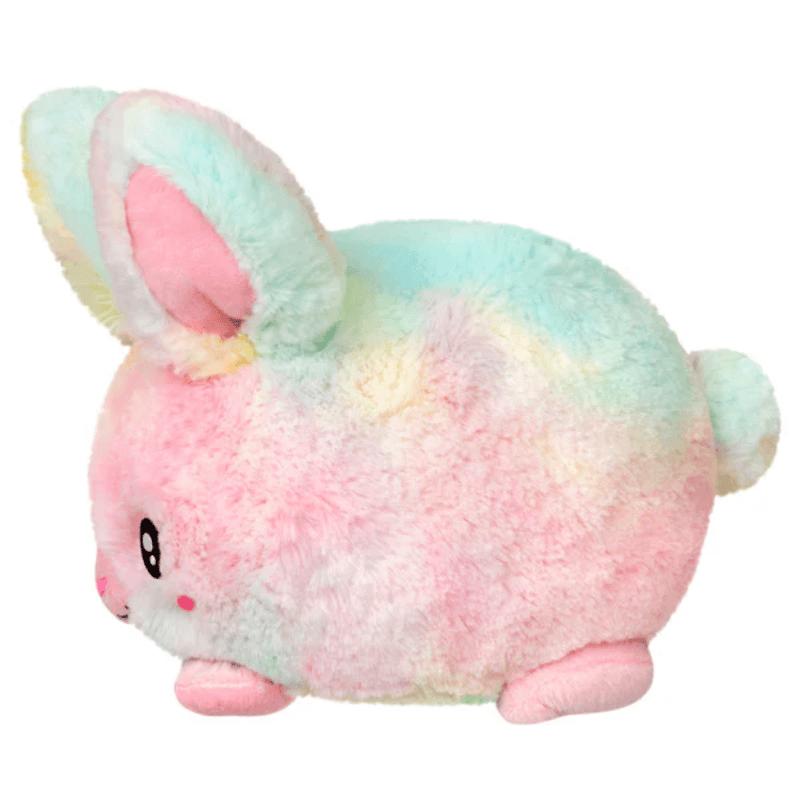 Side view of Squishable Snacker Fluffy Bunny Tie Dye plush toy showing fluffy pastel fur