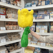 Squishable Tulip plush toy back view held in hand in a shop
