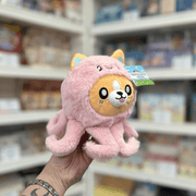 Squishable Undercover Snacker Corgi in Octopus plush toy angled view held in hand in a shop