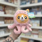 Squishable Undercover Snacker Corgi in Octopus plush toy front view held in hand in a shop