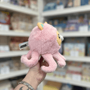 Squishable Undercover Snacker Corgi in Octopus plush toy side view held in hand in a shop