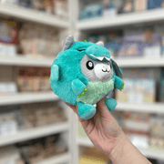 Squishable Undercover Snacker Kitty in Dragon plush toy angled view held in hand in a shop
