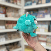 Squishable Undercover Snacker Kitty in Dragon plush toy side view held in hand in a shop