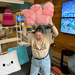 Person holding oversized Squishable Worm Plush in pastel pink
