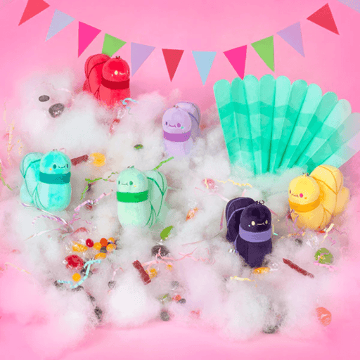 Squishable Candy Shop worm plush keychains displayed among colourful sweets
